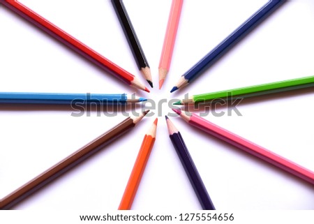 Colored Pencils Circle Formation Above The White Background