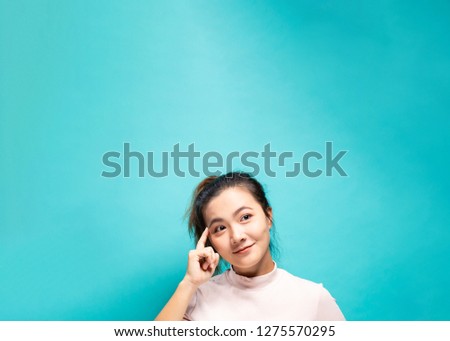 Portrait of positive woman on a blue background