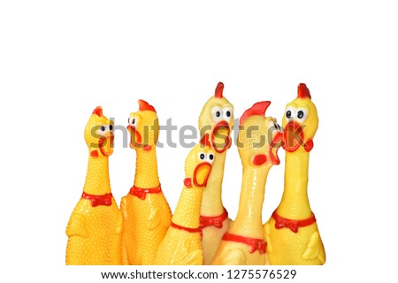 Many funny chicken toy different size on isolated background.