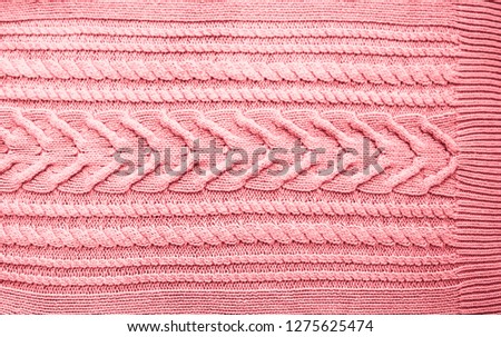 Pink Blush Terracotta Knitted pattern wool sweater texture close up. Handmade red knitting wool texture background