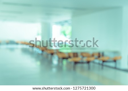 Blurred image background of empty seats and tables in the clean cafeteria or canteen