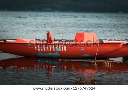 Emergency rowing boat with white Italian lettering "rescue" on the shores of Sicily. Aftermath of nocturne clandestine migrations from Africa and Syria.