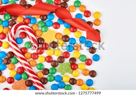Abstract pattern with round color candy on background. Colorful sweets top view. Flat lay image