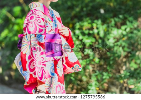 A young woman wearing a kimono