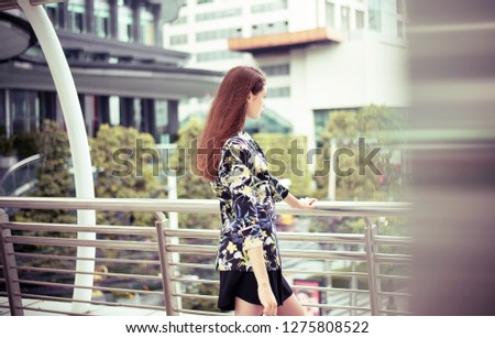 Portrait beautiful woman walking in the city,Female confidence looking for something,Lifestyle concept