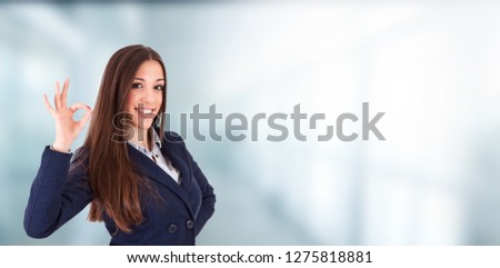 business executive or woman with an expression of success or approval