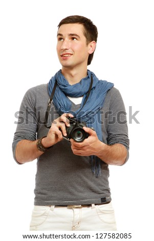 A portrait of a young photographer with a camera, isolated on white