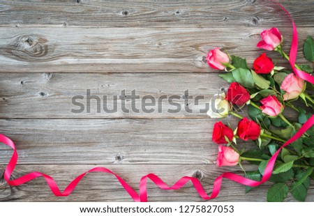 Roses on wooden board. Valentines Day background