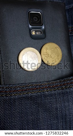 coin and cell phone