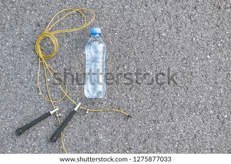 Bottle of water near the jumping rope