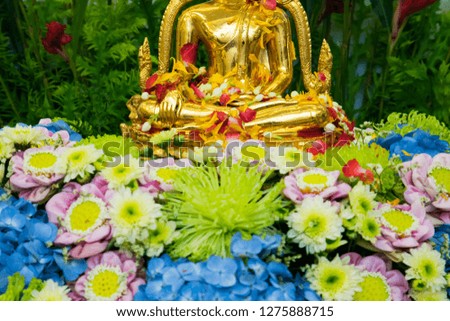 Buddha statue water ceremony in songkran festival.Thai festival Songkran.selective focus.
