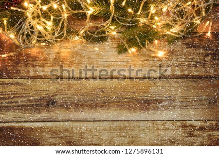 Christmas background with lights on a wooden background