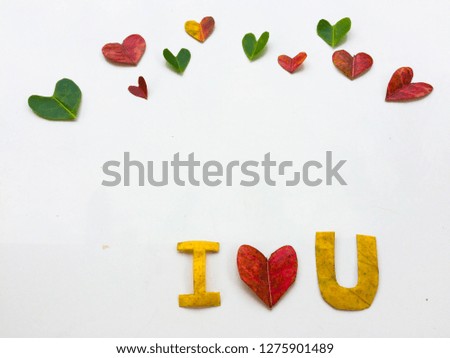 Love card Valentine Day made from colorful leaves on white paper. Heart, Love word, leaf.The concept of Valentine Day.