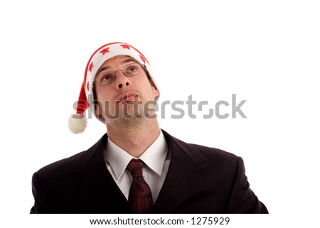 Stock photo of a young businessman wearing Santa hat (expectation)