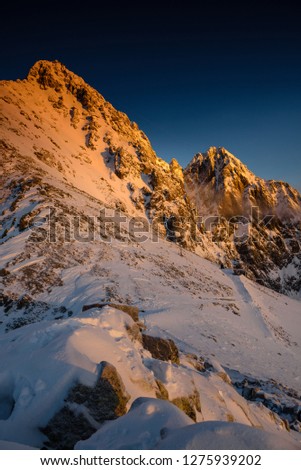 Winter panorama of the Tatra Mountains at sunrise, view of Lomnicky stit peak, Slovakia