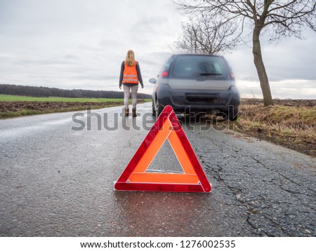Woman with car breakdown