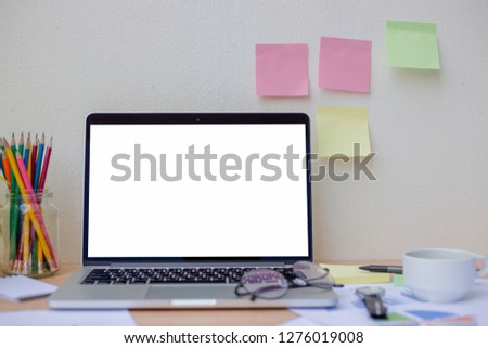 office desk,mockup image computer,laptop with blank screen at workplace on table.design studio creativity ideas business equipment modern accessories,blogging,blog concept