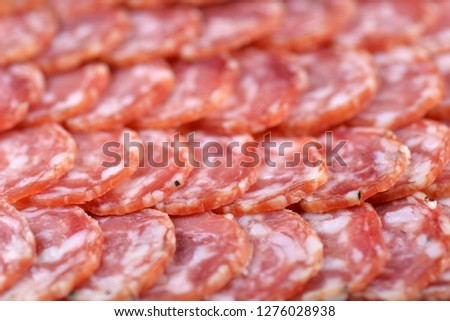 Salami sausage slices background. Close up. Slices of smoked sausage. Food background.