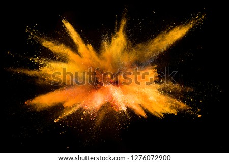 Explosion of colored powder isolated on black background. Abstract colored background Royalty-Free Stock Photo #1276072900
