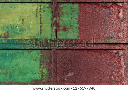 metal rusty surface with shabby green paint