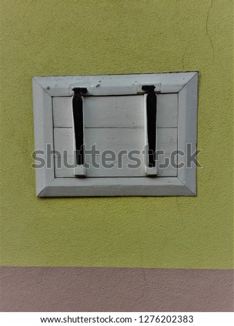 White window  on yellow wall style half-timbered house