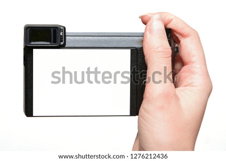 Woman hands hold photo camera Electronic Viewfinder with Interchangable Lens, isolated on white, blank empty screen. Mock up photo camera with clear screen.
