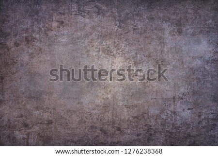 Old washed grunge mottled texture. High-contrast mottled and scratched background. 
Dirty backdrop with black scuffed edges and old faded antique design.