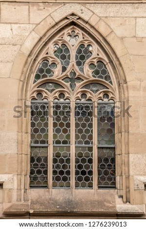 Big window of an old historical building  Royalty-Free Stock Photo #1276239013