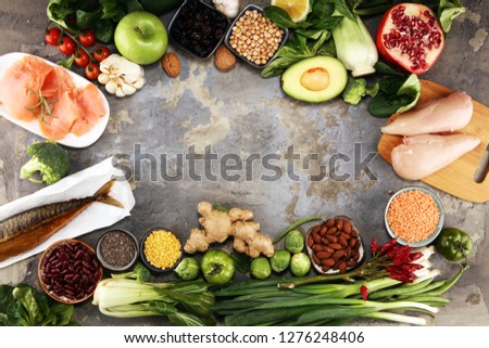 Healthy food clean eating selection. fruit, vegetable, seeds, superfood, cereals, leaf vegetable and fish and chicken.