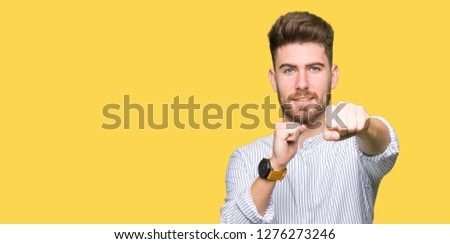 Young handsome man Punching fist to fight, aggressive and angry attack, threat and violence