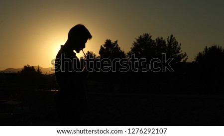 Silhouette of man who smokes