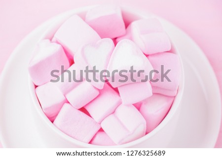 Pink sweet marshmallow hearts in a cup. Soft pink color. Valentine's day background, copy space