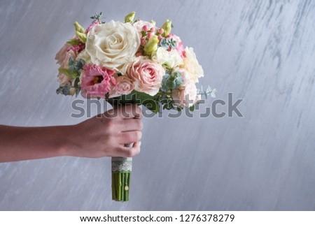 Wedding bouquet on with white roses on gray background in Valentine's day