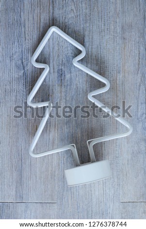 A studio photo of a neon christmas tree