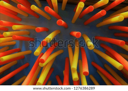 Abstract Colorful foam plastic sticks on black background