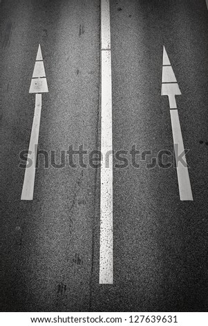 One-way signs on a road/Straight On