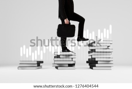 Young businessman student climbing the ladder of education books concept