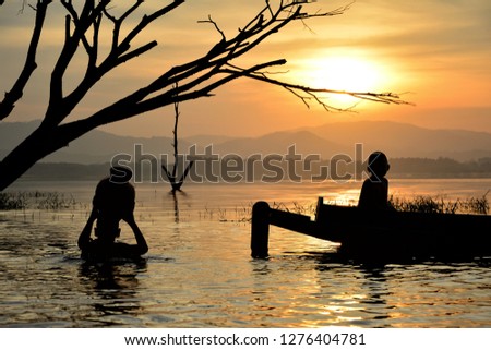 Silhouette Livelihoods of fishermen casting fish in the reservoir