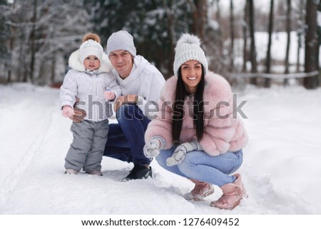 Family photos in the snow.Young family.Happy family in the winter 
