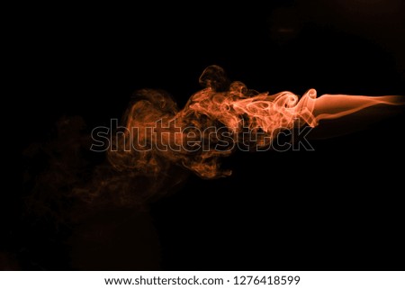 Brown coloured smoke abstract lighting on a black background