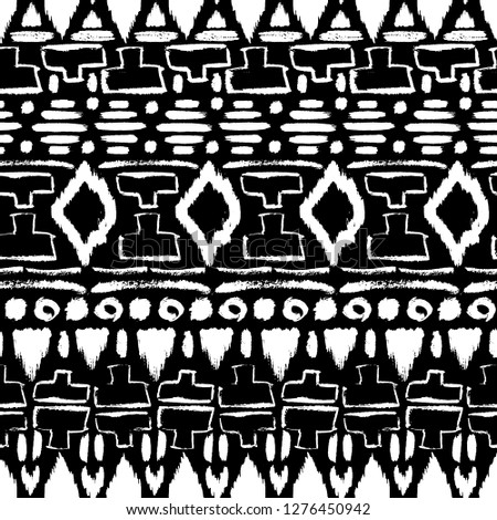 Grunge pattern. Ethnic fabric design. Aztec. Tribal. Boho. Fashion. Paint lines ornament. Ink strokes. Abstract seamless texture. Black and white. Fabric design. Traditional pattern. Hand drawn.