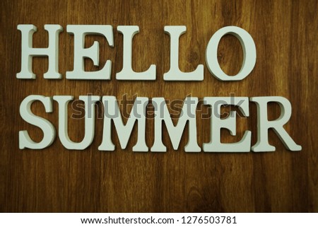 hello summer alphabet on wooden background