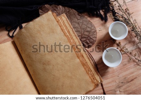 Autumn composition,autumn leaves ,Black scarf and paintbrush on wood background. Flat lay, top view, copy space - Image