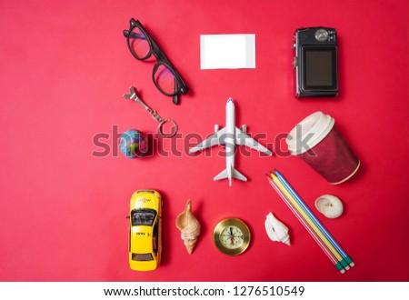 set of objects for travel isolated on red paper background. 