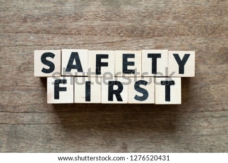 Letter block in word safety first on wood background