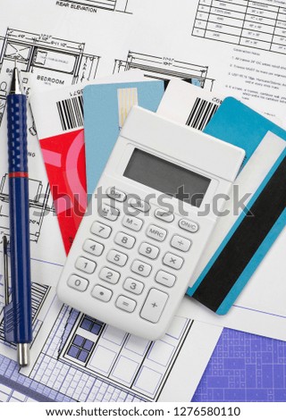 Calculator over credit card and papers