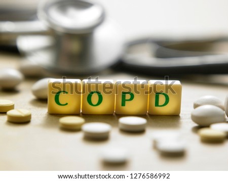 Wooden block form the word COPD with stethoscope. Medical concept. 