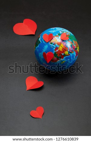 Global Valentines Day Concept  Earth with Heart on dark background