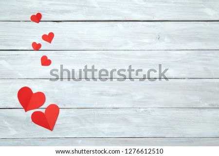Red paper shape hearts isolated on white wood background, decorations for Valentine's Day, Empty space for design