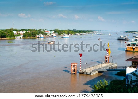 Boats and floating houses on Mekong river in the Mekong delta, An Giang, Vietnam